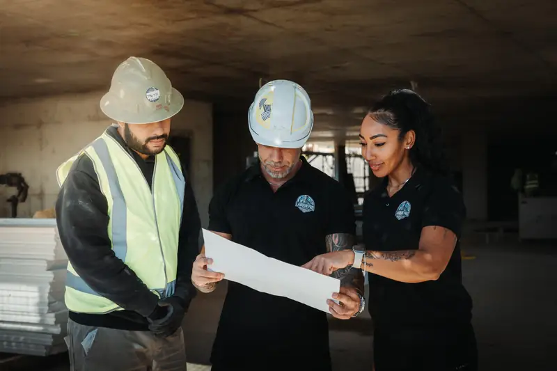 Labour Pro Group team reviewing plans together on site